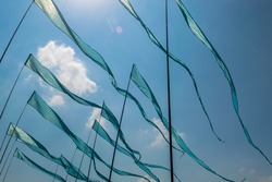 Blue flags waving in the wind at kite festival in Moscow