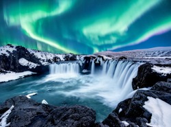 A wonderful night with Kp 5 . Northern lights The Godafoss is a waterfall in Iceland.