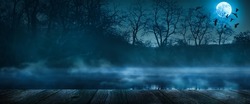 mystic natural halloween background for party invitation card, shining  moonlight on wooden planks, misty lake and trees with copy space for product presentation, halloween party concept banner