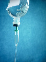 Fluid replacement therapy, Close up saline solution drip for patient and infusion pump in hospital