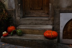 pumpkins on the steps at the door. Decorations for Halloween. Copy space for your text