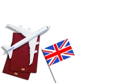 Visa to Britain concept. Text visa near passport cover and british flag on white background top view