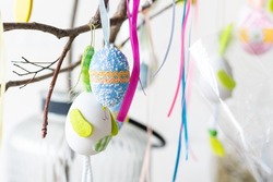 Decorative easter eggs on tree branches.