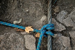 Climbing rope tied with a metal rope knot, climbing rope and knot