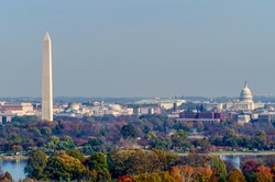The Washington Monument and United States Capitol Building stand tall amongst the fall landscape of Washington D.C.