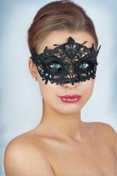 Mask.Nude.Girl.Venice carnival mask Close-up female portrait.Blue eyes.