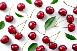 Cherries. Cherry background. Cherries top view. Cherry with leaves on white background.