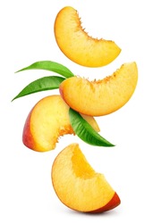 Peach isolated. Peach slices flying on white background. Falling peach pieces with leaf. Full depth of field.