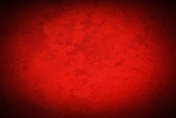 Texture of red decorative plaster or concrete with vignette. Abstract grunge background for design.
