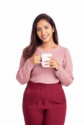 Young woman holding tea cup isolated on white.