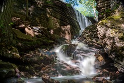 Martorpsfallet Waterfall, Creek decending in forest on limestone rock