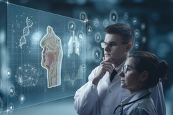 The concept of modern technologies in medicine. Two doctors study the anatomy of the throat and nose on a virtual computer screen.