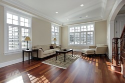 Living room in luxury home with cherry wood flooring