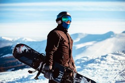 Close up portrait guy holding snowboard in winter, sports wear, helmet, sunglasses, winter, up, freedom, nature, attractive, clothes, sport, competitions, winter holidays, alps, travel, hiking