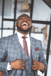 Happy Laughing Rich African American Businessman. Successful Media Tycoon In Stylish Expensive Suit. Concept Of Rich Life, Successful. High quality photo