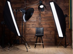 Lighting set up in photostudio with wooden background
