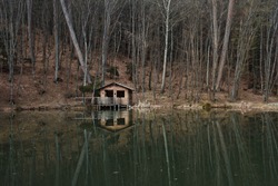 Mountain cabin in reflection