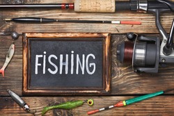 blackboard with the word fishing, and other accessories