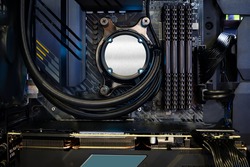 Close-up Cooling pump on CPU socket and quad channel RAM DDR4 that installed on modern mainboard with LED RGB light show status on working, inside desktop on PC Case and DIY, computer and electronics