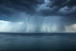 Heavy rain over the sea, weather, atmosphere.