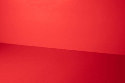 Red studio gradient background for product placement or website. Copy Space, horizontal composition.