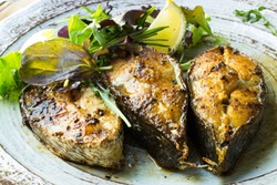 
grilled fish fillets from the meagre