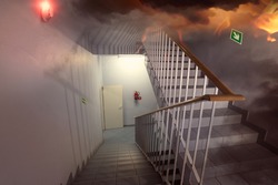 fire and an escape route in the staircase in the building 