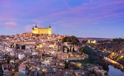 Panoramic view of the medieval center of the city of Toledo, Spain. It features the Tejo river, the Cathedral and AlcÃ¡zar of Toledo.