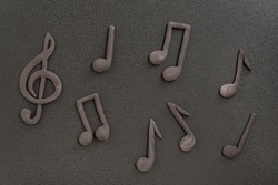 Treble clef and music notes on black background. Music symbol. Key of G. Violin key. Musical notation. Copy space