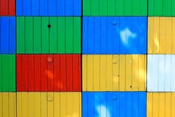 Close-up of old colorful bee hive boxes. Colorful abstract background.