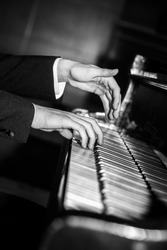 Pianist hands playing black and white