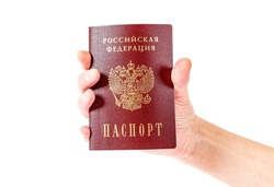 Russian passport in the hand on the white background