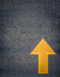 Conceptual Image Of A Painted Yellow Arrow On A Road With Space For Text