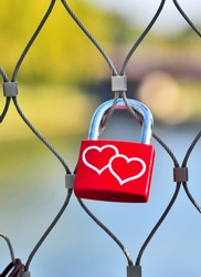 padlock heart, love symbol on a fence or bridge