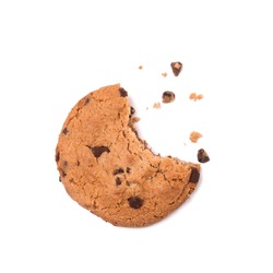 Single round chocolate chip biscuit with crumbs and bite missing, isolated on white from above. Sweet biscuits. Homemade pastry. Chocolate chip cookie.