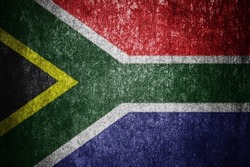 Closeup of grunge South African Republic flag. Dirty South Africa flag on a metal surface.