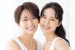 Smiling Asian women looking at the camera