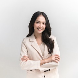 Studio portrait photo of young beautiful Asian woman in formal suit dressing with confident and luxury looking and attractive on white background studio shot.