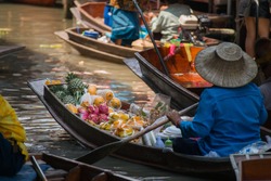 selective focus of fruit in a boat at Damnoen Saduak floating market Ratchaburi near Bangkok, Thailand