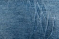 Blue Jeans Background Pattern. Classic denim Jeans fabric Texture. Creases of jeans texture. Copy space.