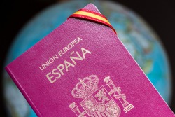 Spanish passport, spanish flag and earth globe