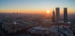 Milan city skyline at sunrise, aerial view. Panoramic view of new skyscrapers in Citylife district at dawn.