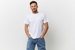 Happy cheerful tanned handsome man in basic t-shirt smile at camera posing isolated on over white studio background. Copy space Banner Mockup. People emotions Lifestyle concept. Model snapshots