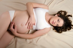 The portrait of the beautiful  pregnant woman