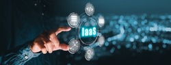 IaaS - Infrastructure as a service, Businessman hand touching Infrastructure as a Service icon on VR screen, networking and application platform. Internet and technology concept.