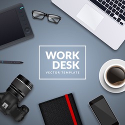 Office desk table with laptop, photo camera, glasses, graphic tablet, pencil, notebook, phone and coffee cup. Top view with copy space. Eps10 vector template.