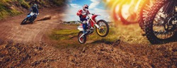 Banner rider mountain dirtbike enduro participates in motocross, jumps on springboard against background dirt. Concept extreme action sport racing.