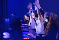 Team professional gamer playing winning tournaments online games computer.