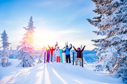 Group of snowboarders and skier dawn with snowboards rejoice snow Light sun in winter forest sunrise. Concept life style, travel.