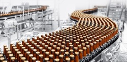 Brown glass beer drink alcohol bottles, brewery conveyor, modern production line.